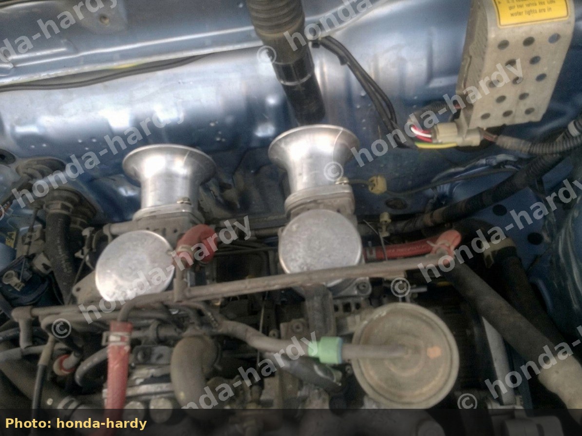 Top view of dual carb trumpets in engine bay